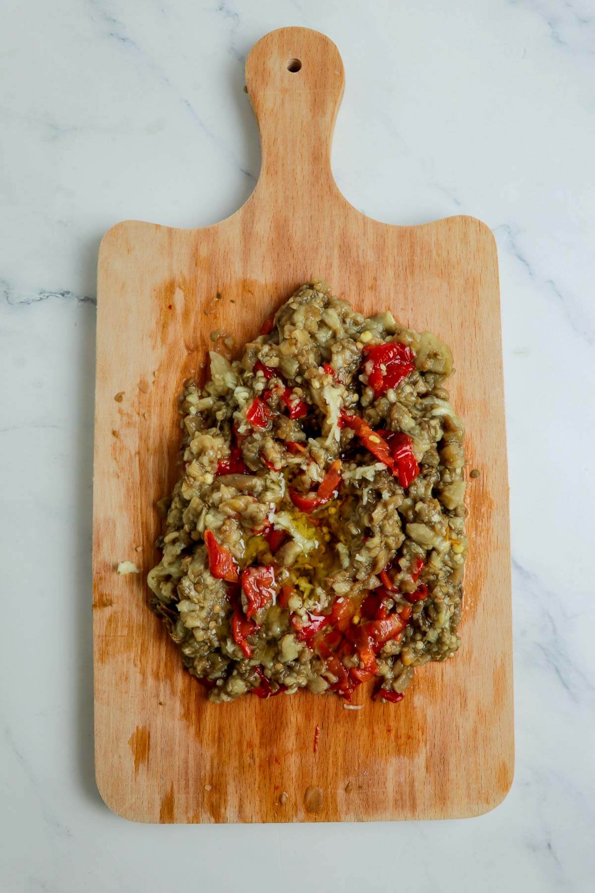 Baigan choka is a Caribbean vegetarian dish that is robustly flavored with garlic and roasted. This mashed treat is best served with roti or rice . Combined baigan with peppers and coconut oil.