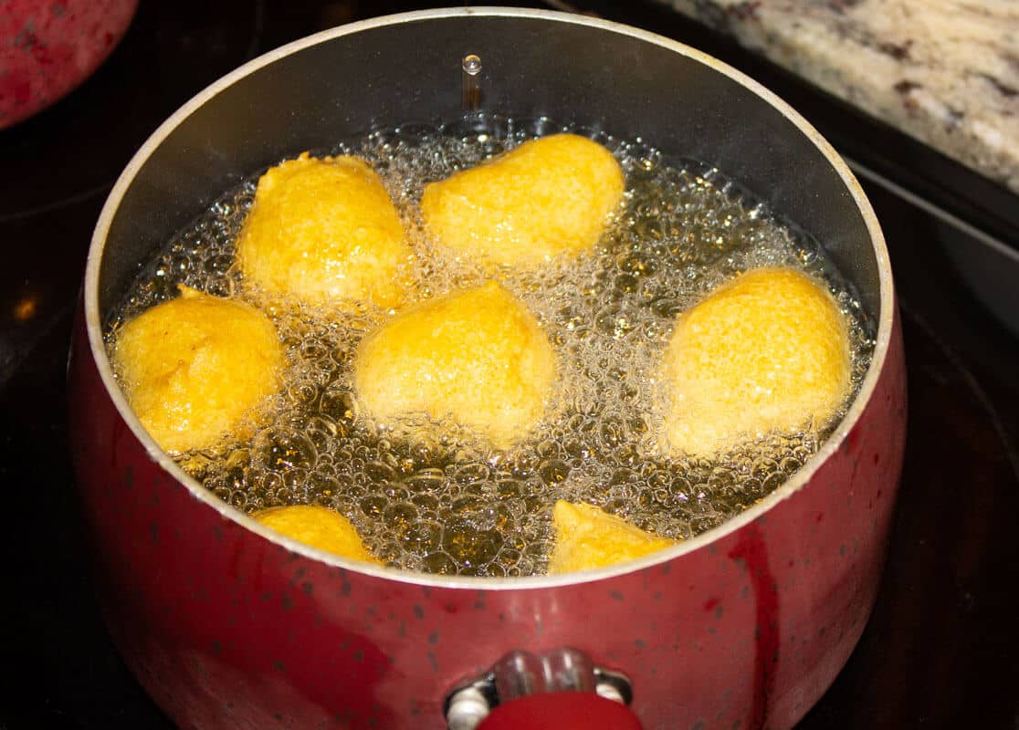 An easy recipe on how to make pholourie, a fried, spiced, flour mixture popularly eaten as a snack in Trinidad and Tobago, Guyana and Suriname.