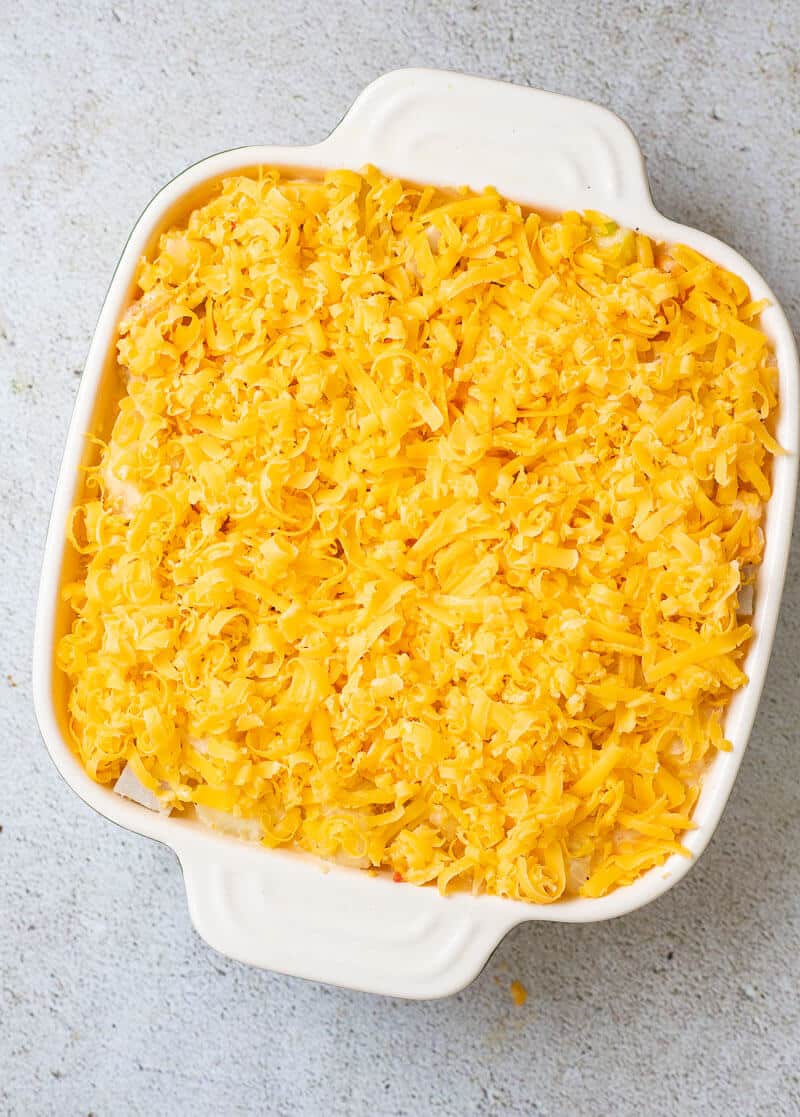 ground provision pie topped with grated cheese before baking