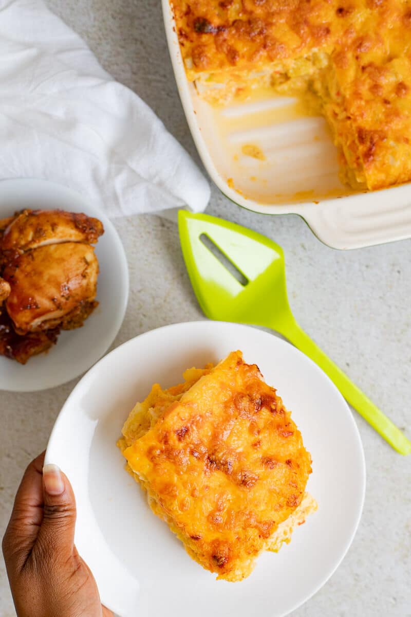 slice of ground provision pie served with baked chicken