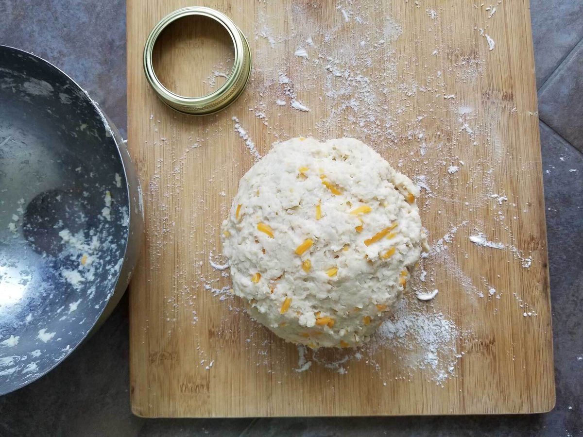 Ball of coconut bake biscuit dough mixed with grated coconut and cheese