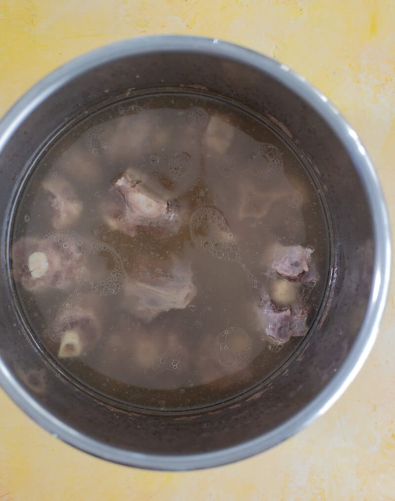 Oxtail partially cooked before making Caribbean oxtail soup