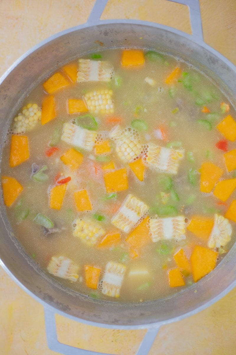 Oxtail soup thickened with split peas before adding dumplings.