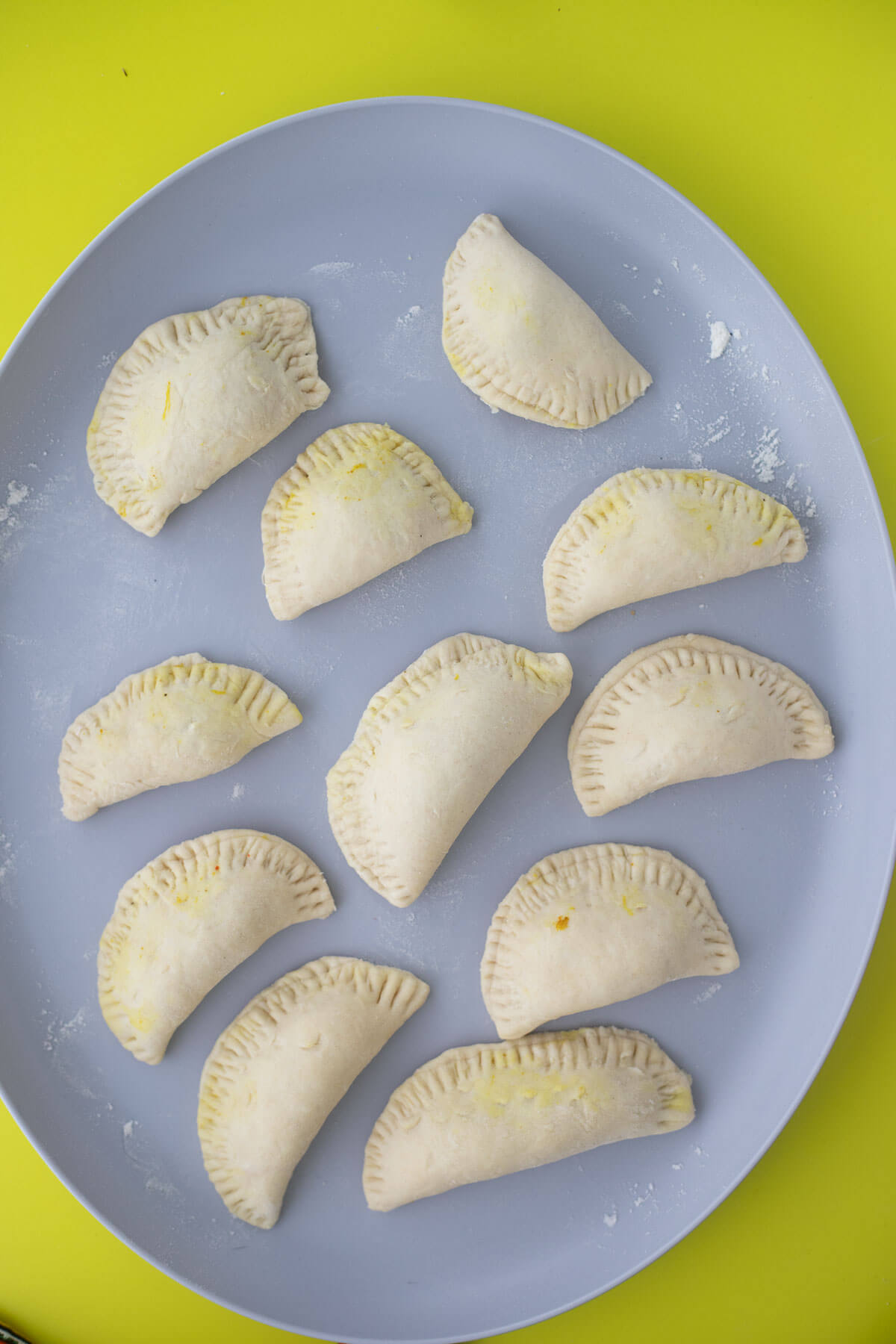 Folded dumplings stuffed with curry crab.