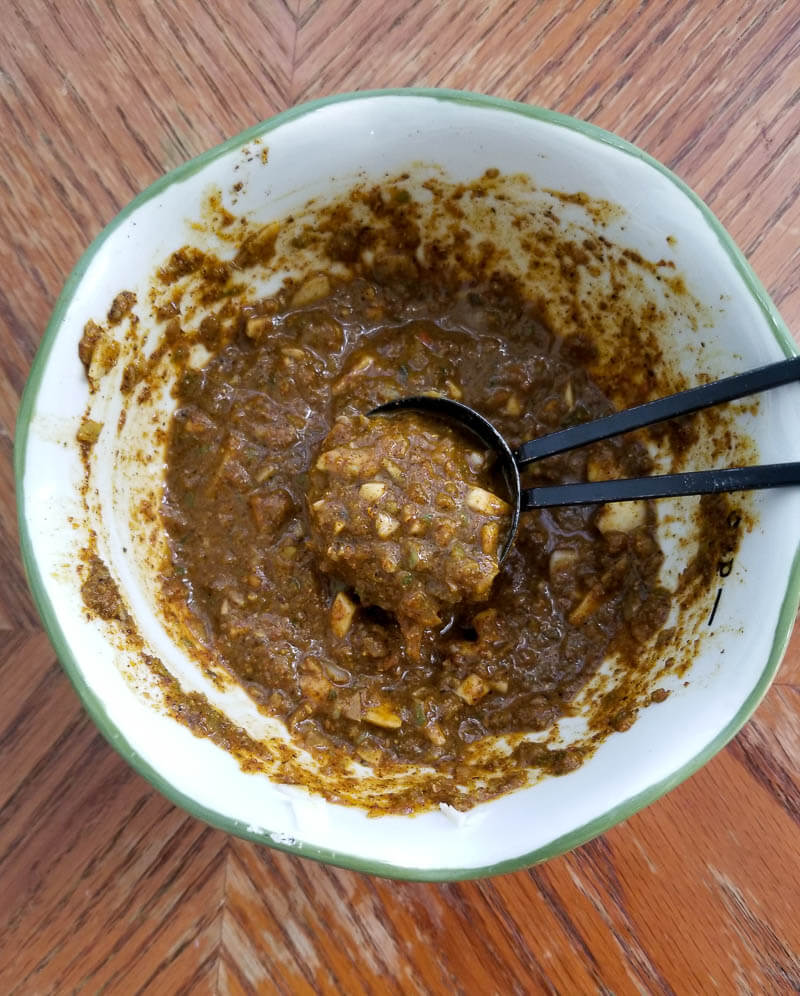 A picture of the curry paste made to be used to curry the lamb.