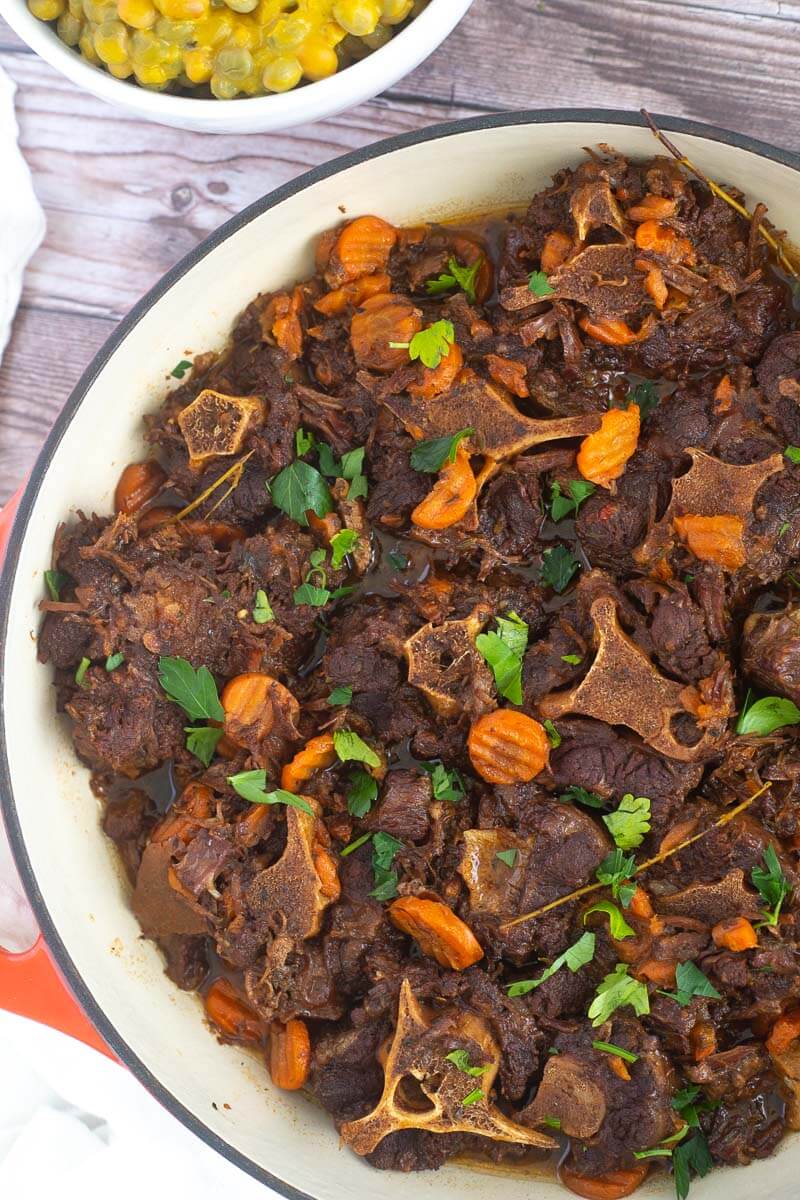 Completed Trinidad stew oxtail, in a pot with carrots.