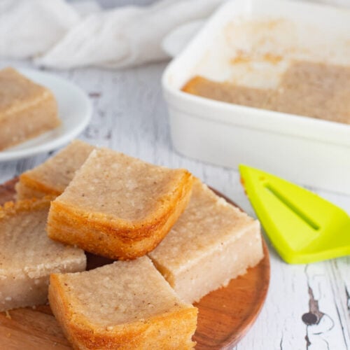 Plate stacked with baked cassava pone.
