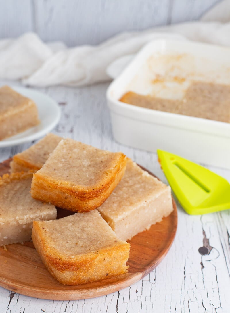 Plate stacked with baked cassava pone.