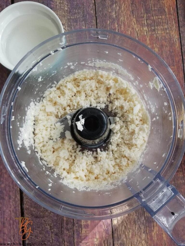 A picture of cassava grated in a food processor