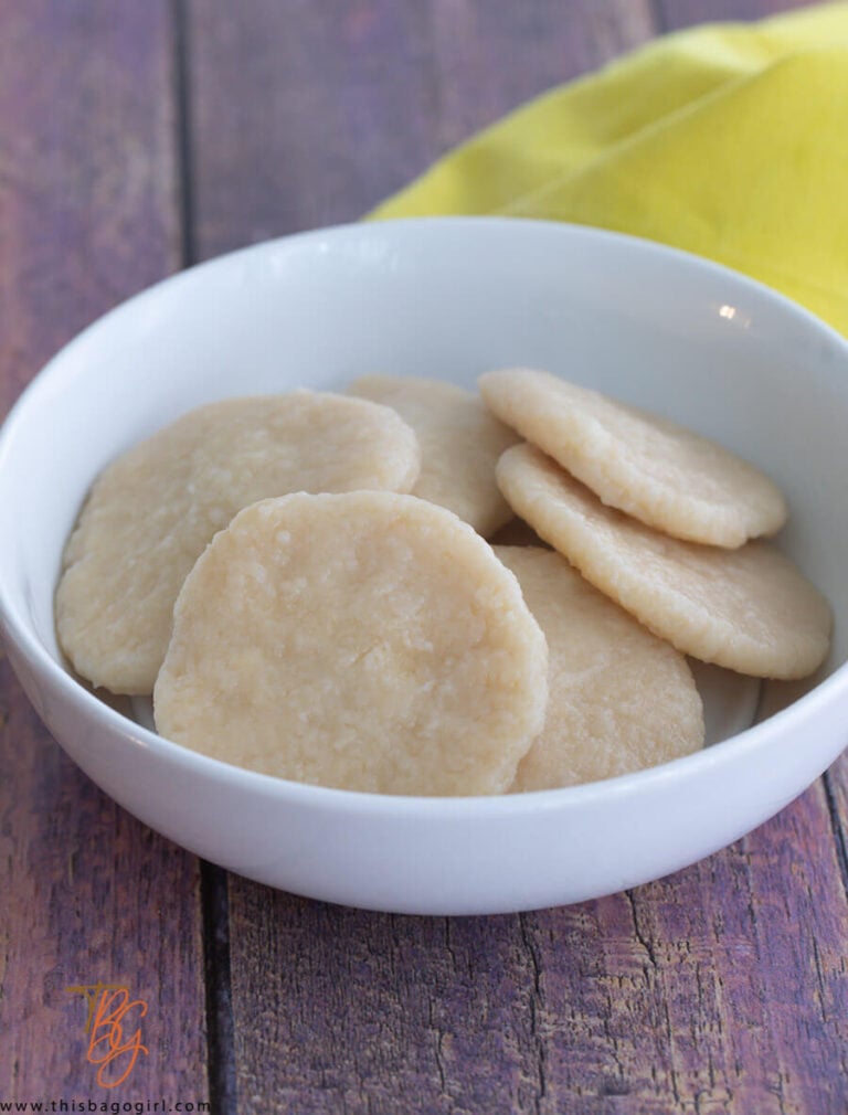 A picture of a white bowl of boiled cassava dumplings.