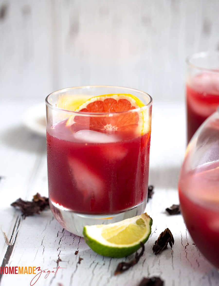 This is a close up of the rum punch with a slice of orange in the glass