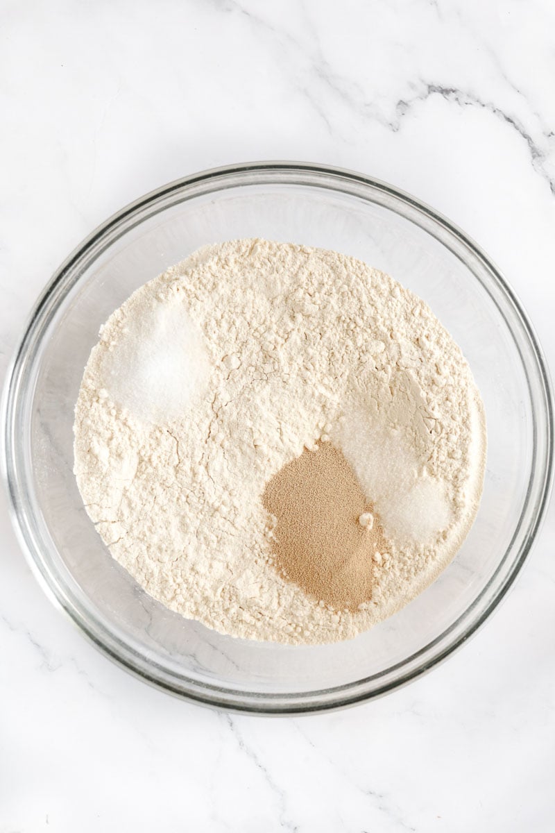 Dry ingredients of flour, sugar, salt, yeast for making hops bread.