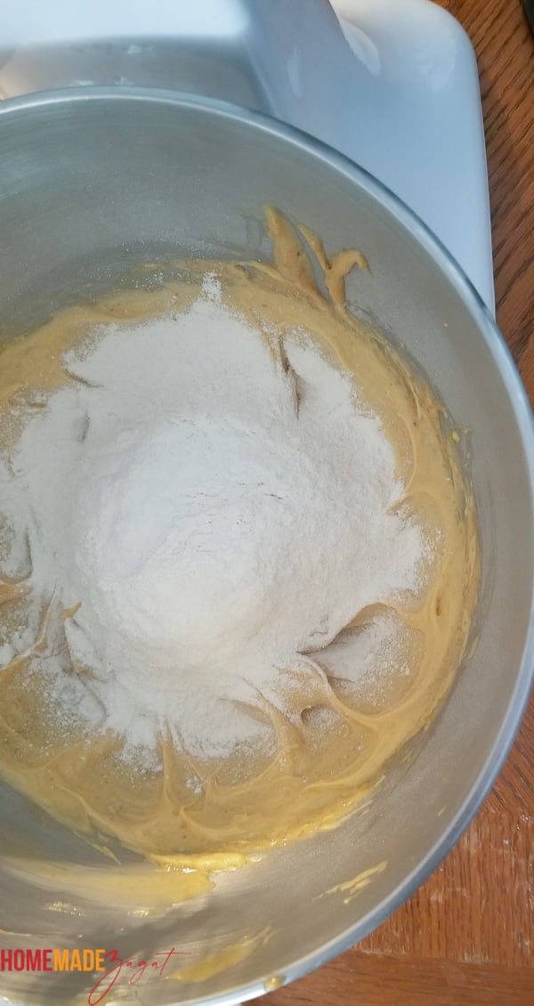 A bowl of mixture and flower for the cake