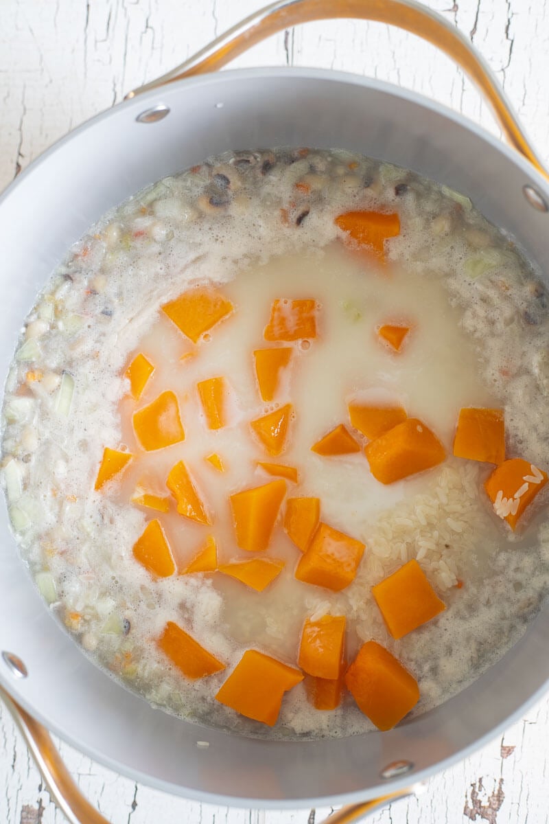 Added rice and pumpkin and coconut milk to dish to make peas and rice.