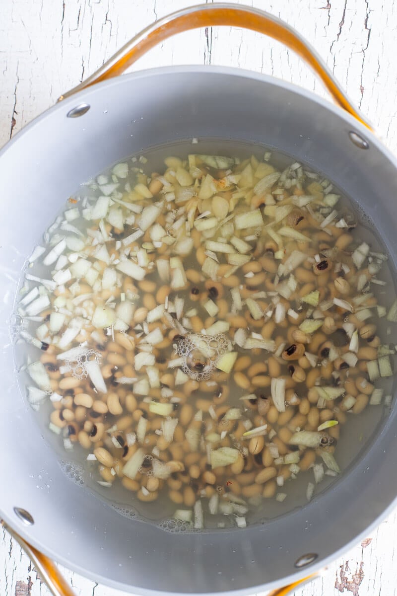 Black eye peas, onions, garlic and seasoning about to be boiled to make cook-up rice.