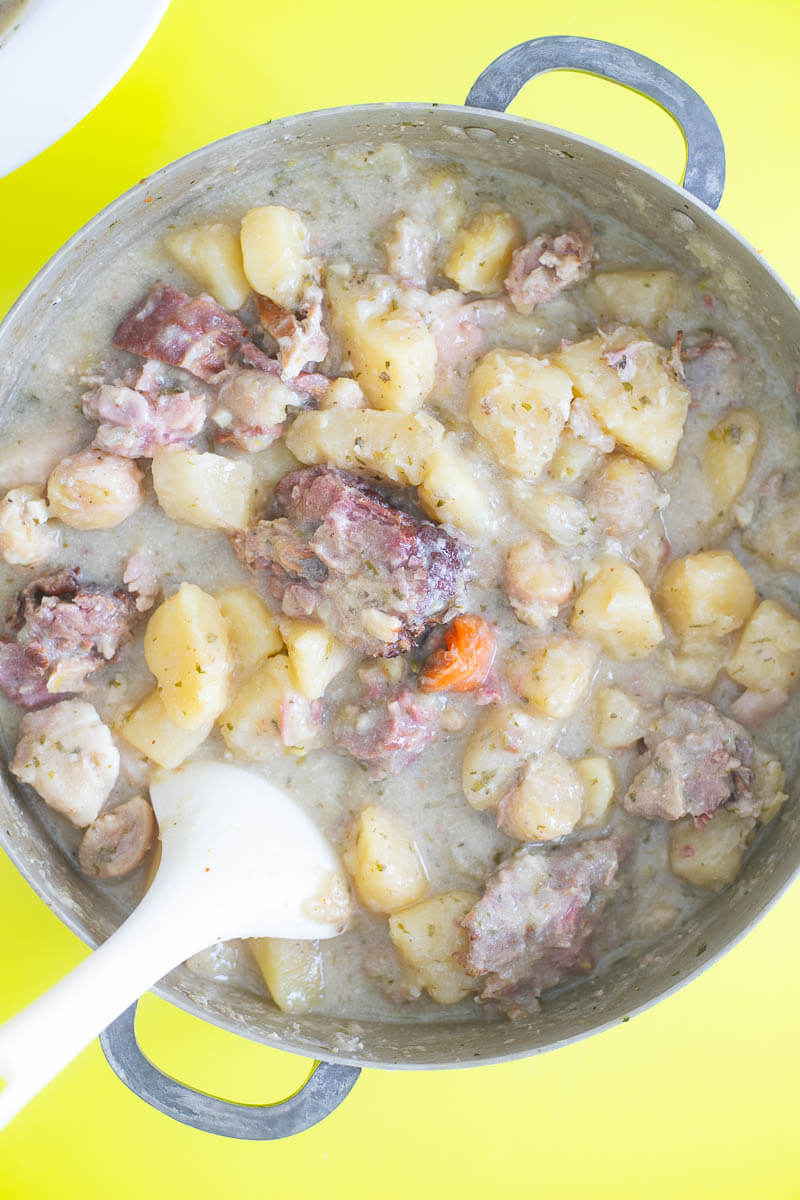 Oil down simmered down where the coconut milk is coating the meats and provisions.