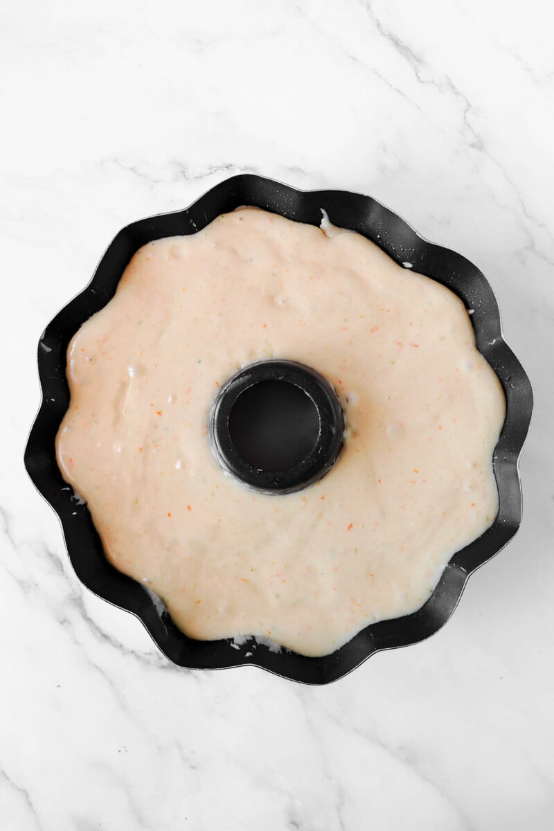Cake batter in a tube pan about to be baked.