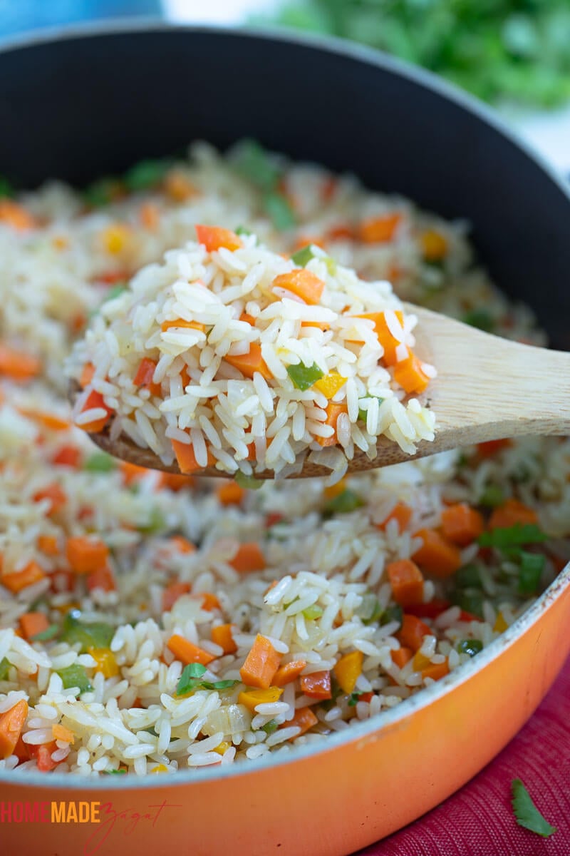 Close up of a spoon full of calypso rice