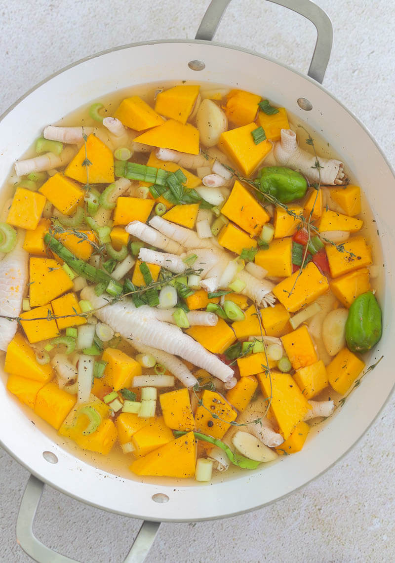 Creating the base of the soup, boiling the pumpkin and spit peas with herbs and chicken foot.