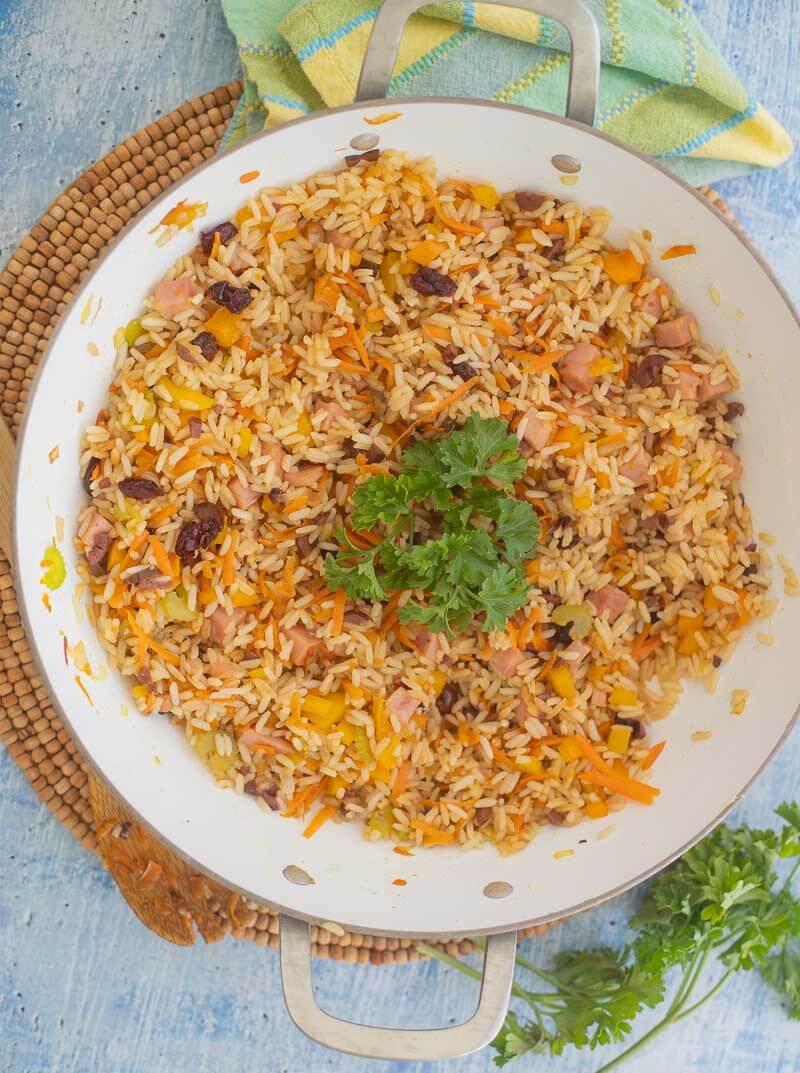 Finished Christmas rice with a garnish of parsley leaves.