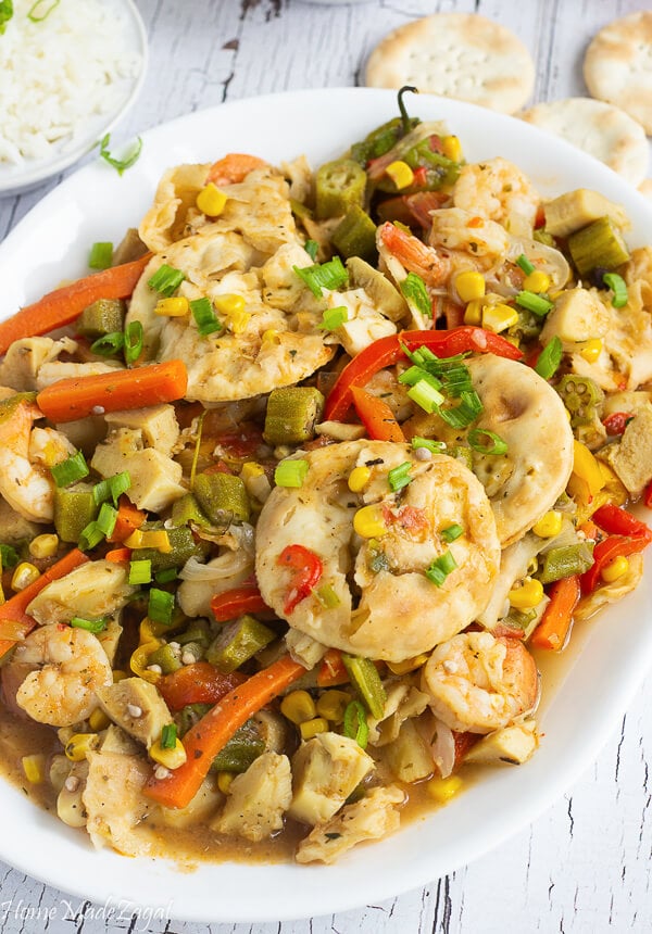 CLose up of the conch cooked with the water crackers