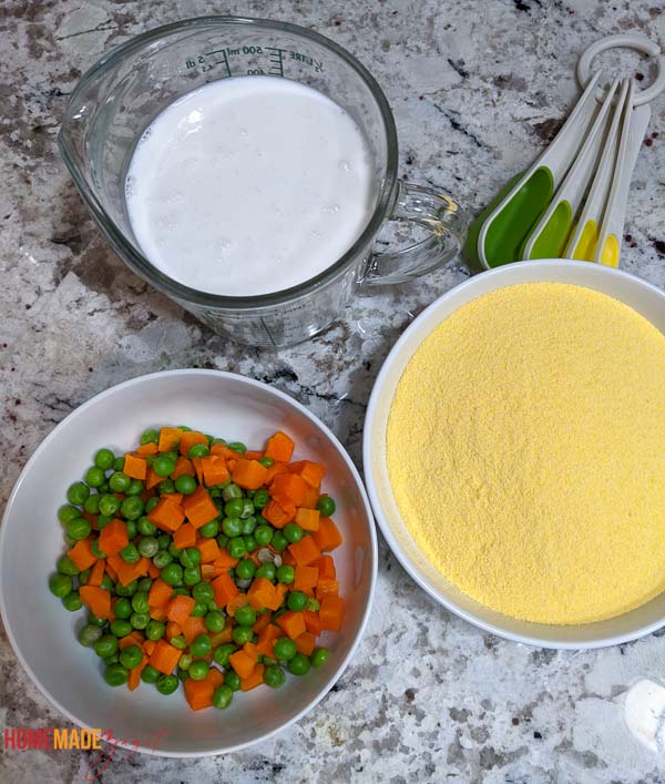 Ingredients needed for making cou cou all shared out in bowls.