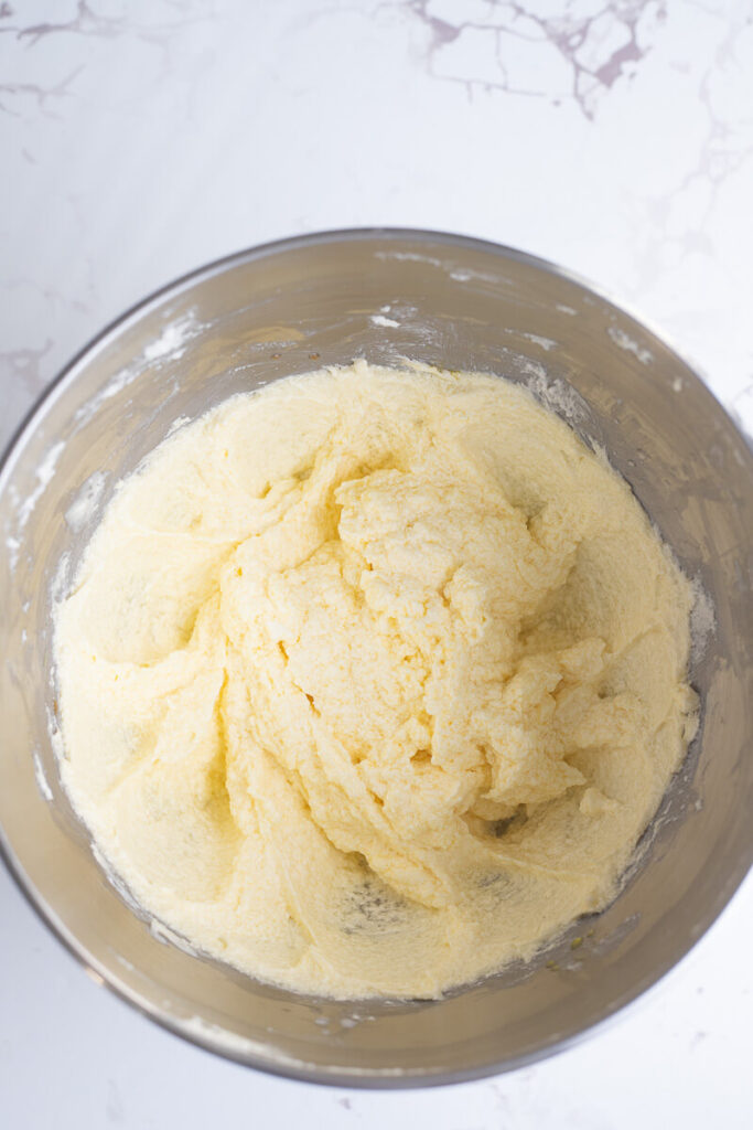 Creamed butter and sugar with sour cream for sorrel cake.