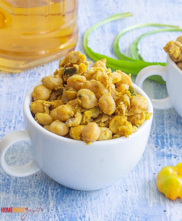 A close up of curried chicpeas in a cup