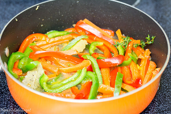 Veggies being cooked in vinegar sauce
