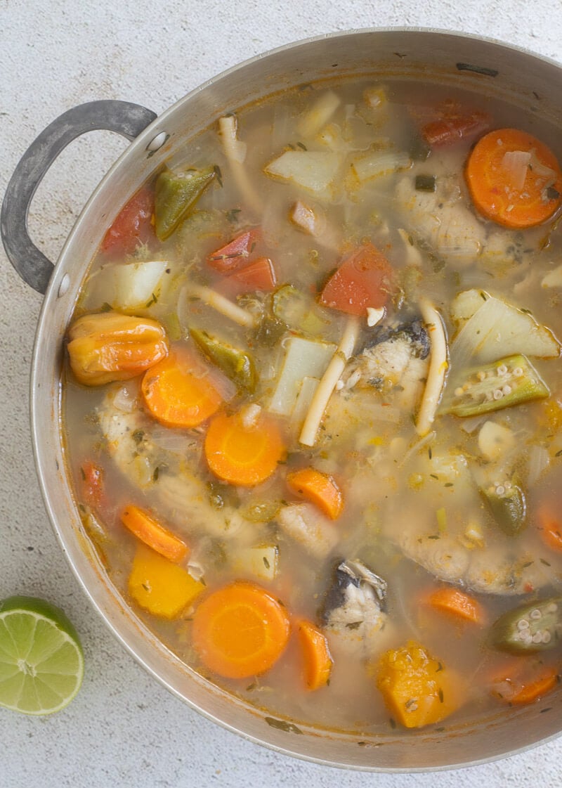 Finished simmered fish soup in a large silver pot.