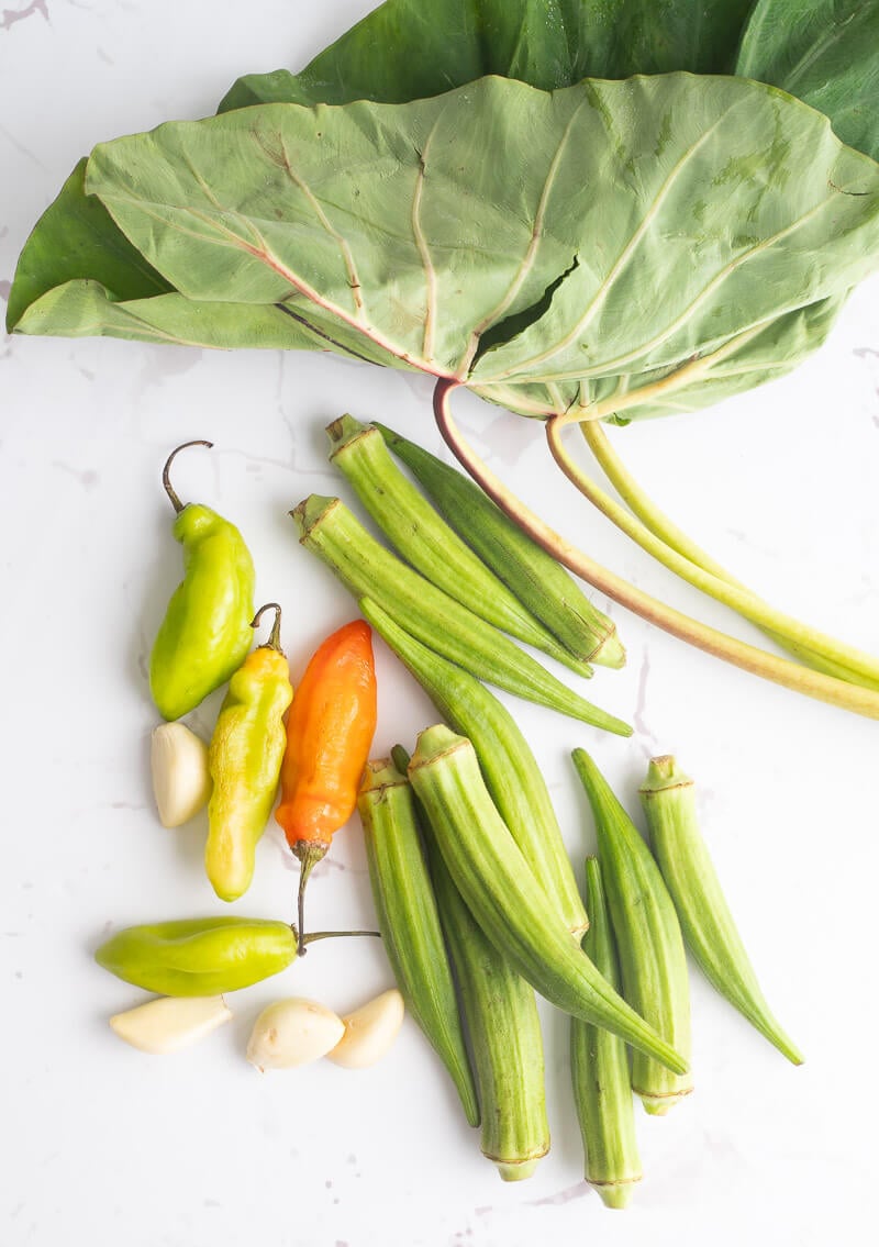 Ingredients needed to make dasheen bush callaloo with peppers and ochros.