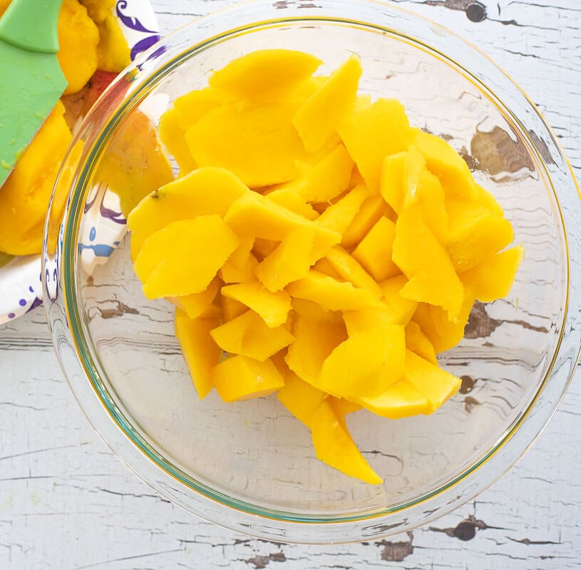 A bowl of mango flesh peeled and cubed.