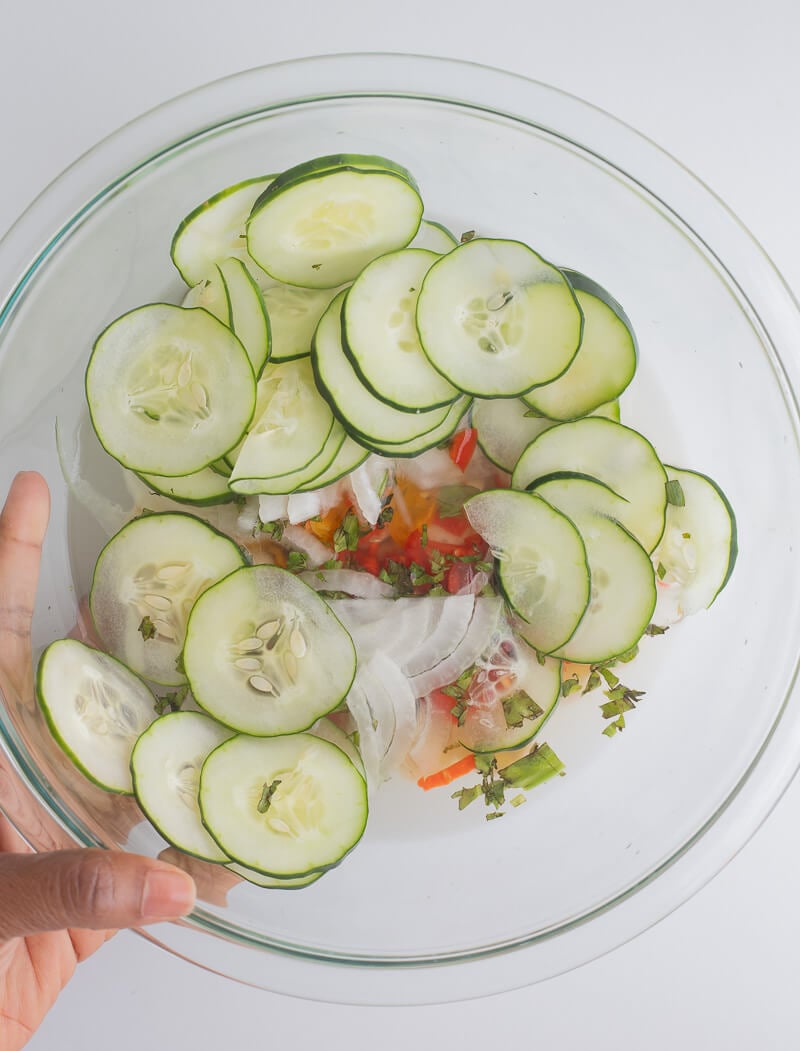 Added in the fresh herbs and spices to the green fig in a bowl of water.