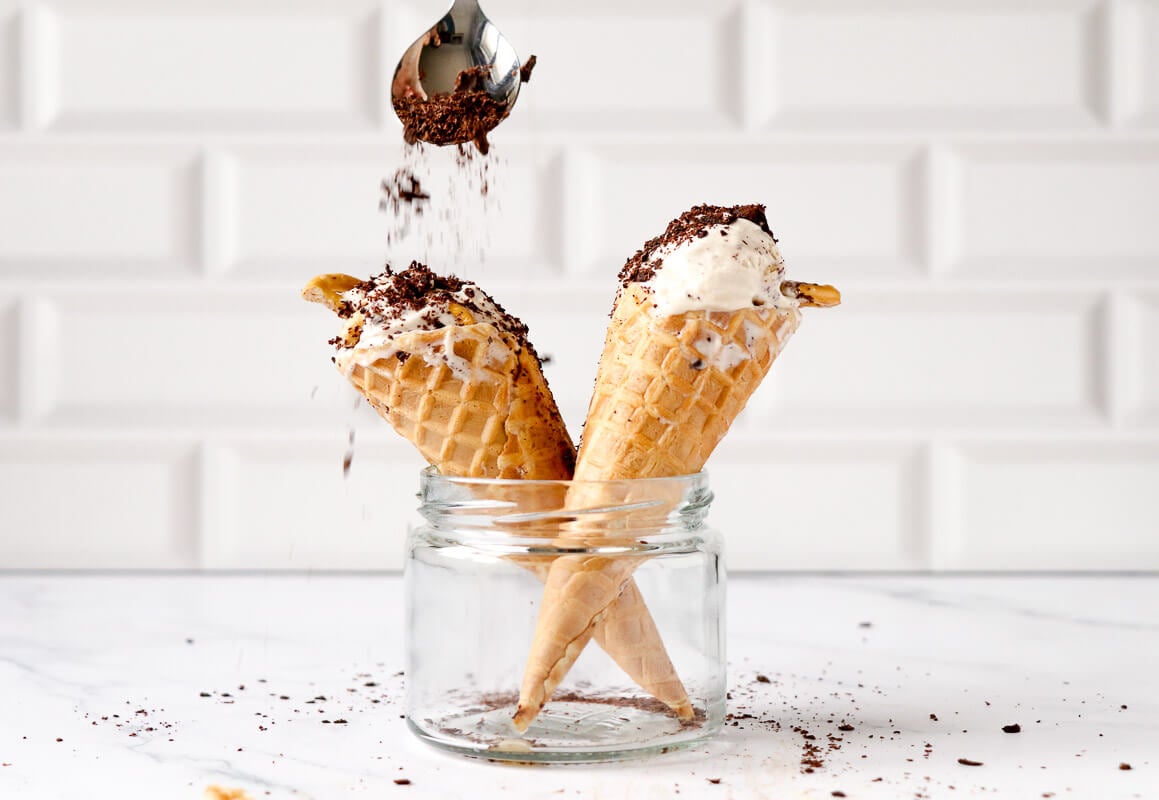 Guinness ice cream in cones with sprinkles of chocolate.