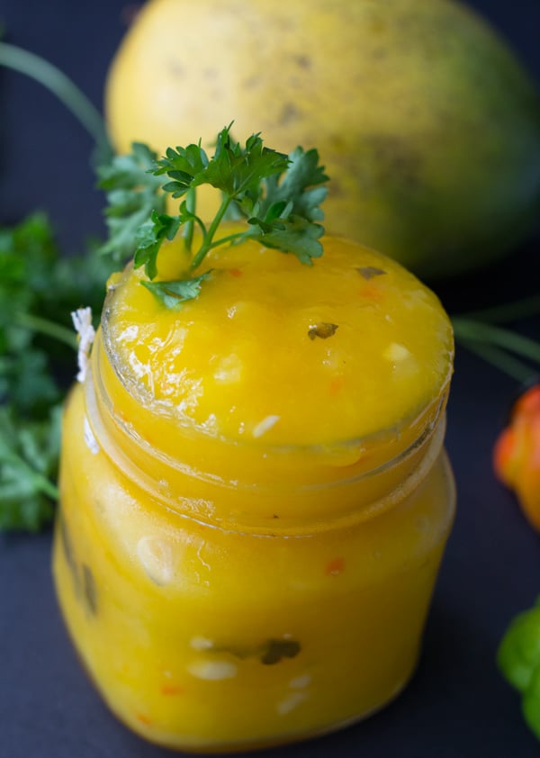 A top view of a bottle of completed Guyanese mango sour.