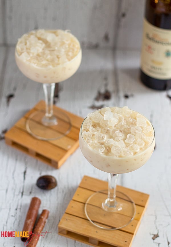 Two glasses filled with ice and creamy cremas.