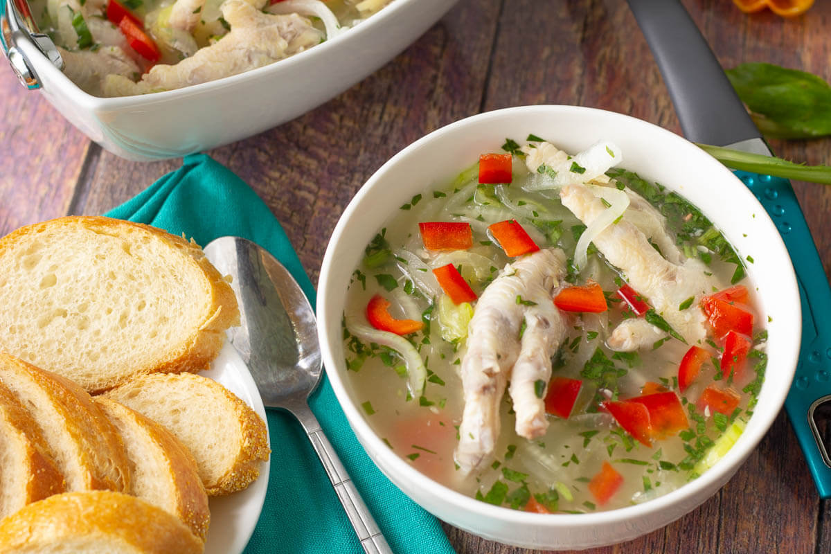 A serving of souse with bread on the side.