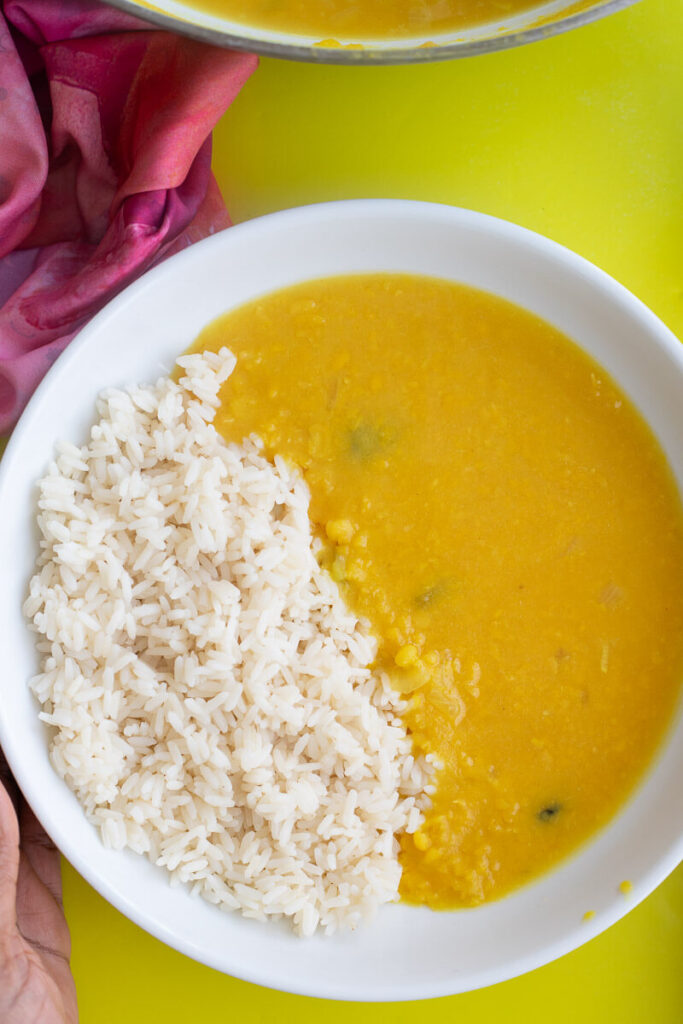 Dhal in a white bowl served with white rice.