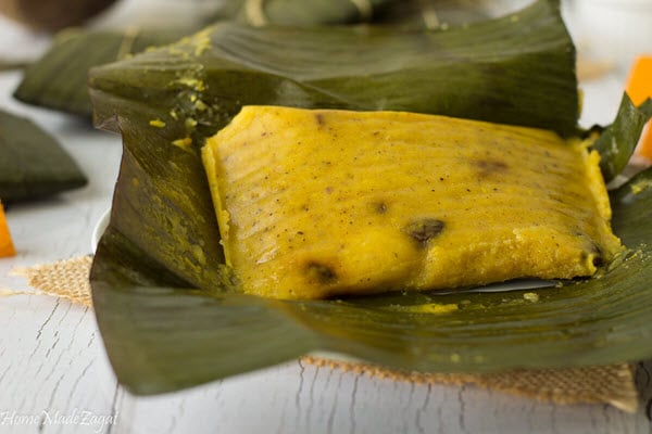 A steamed paime opened in a banana leaf.