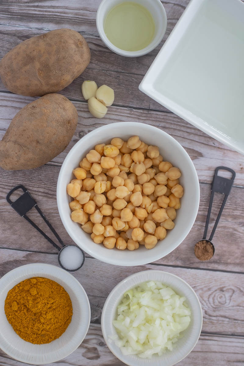 Ingredients needed to make curry channa and aloo showing the portion sizes.