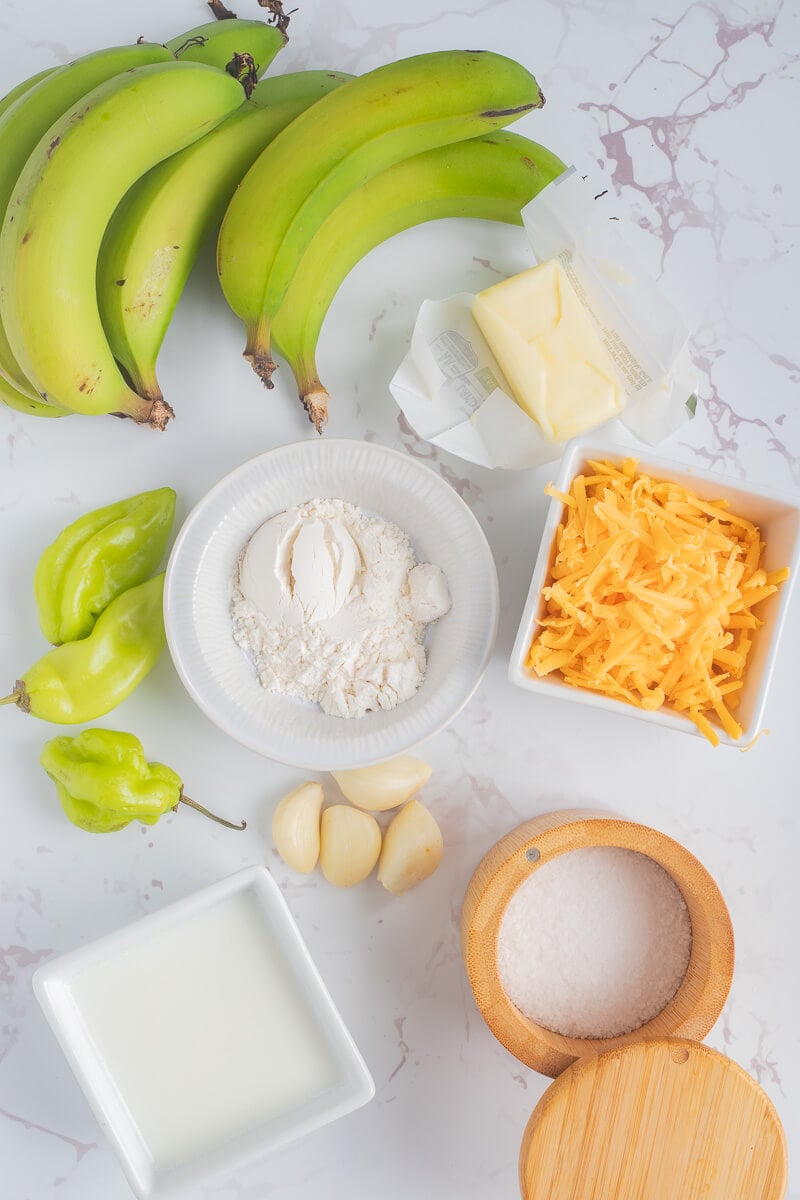 Ingredients needed for making this green banana pie on a white background.