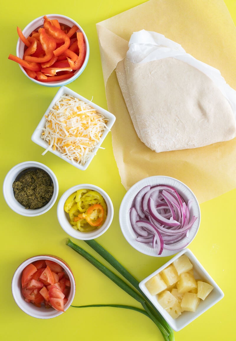 Ingredients laid on out and ready to be used to make the pizza. 