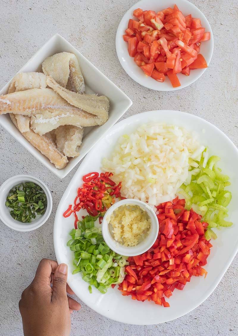 A picture of ingredients for making stew saltfish.