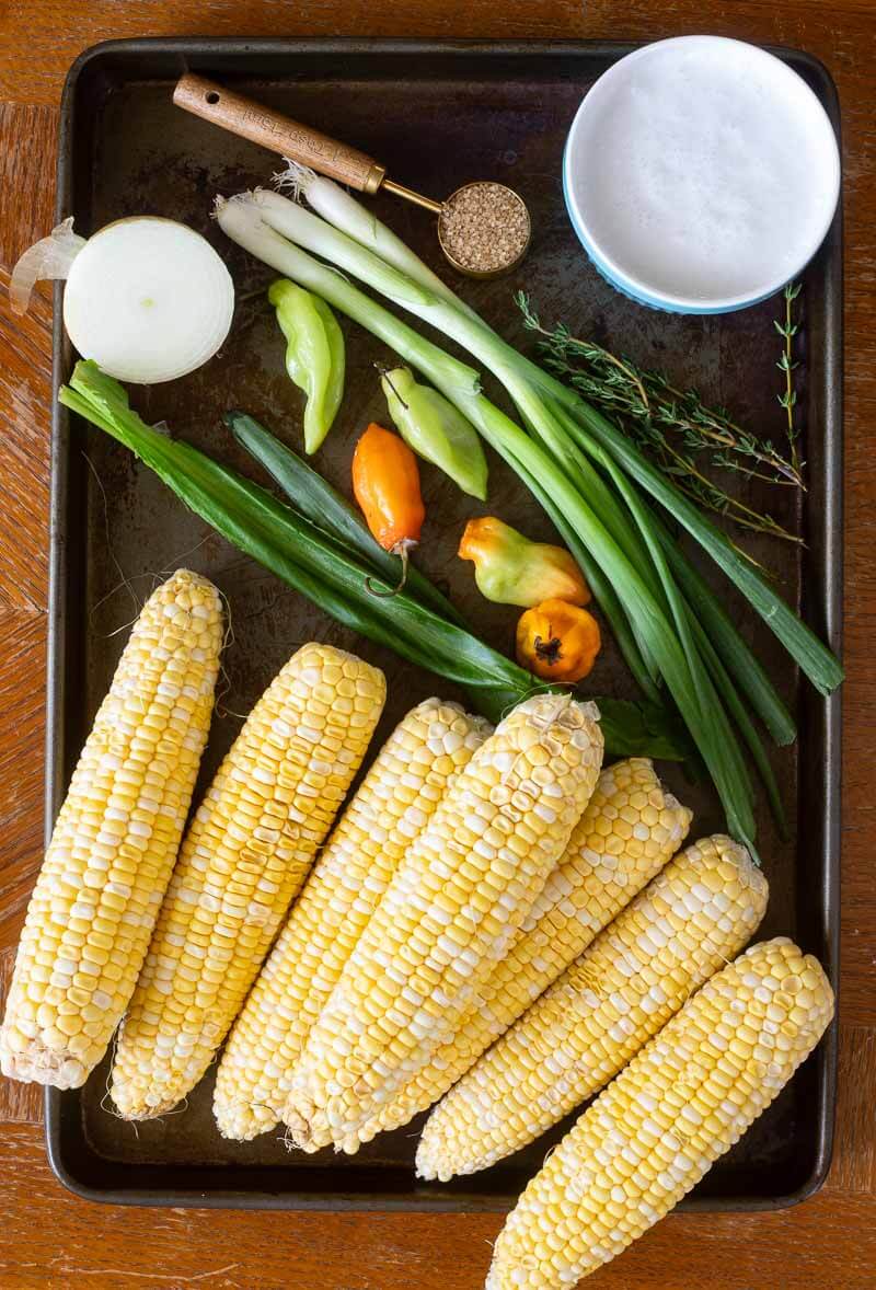 Ingredients for boiled corn in a tray.