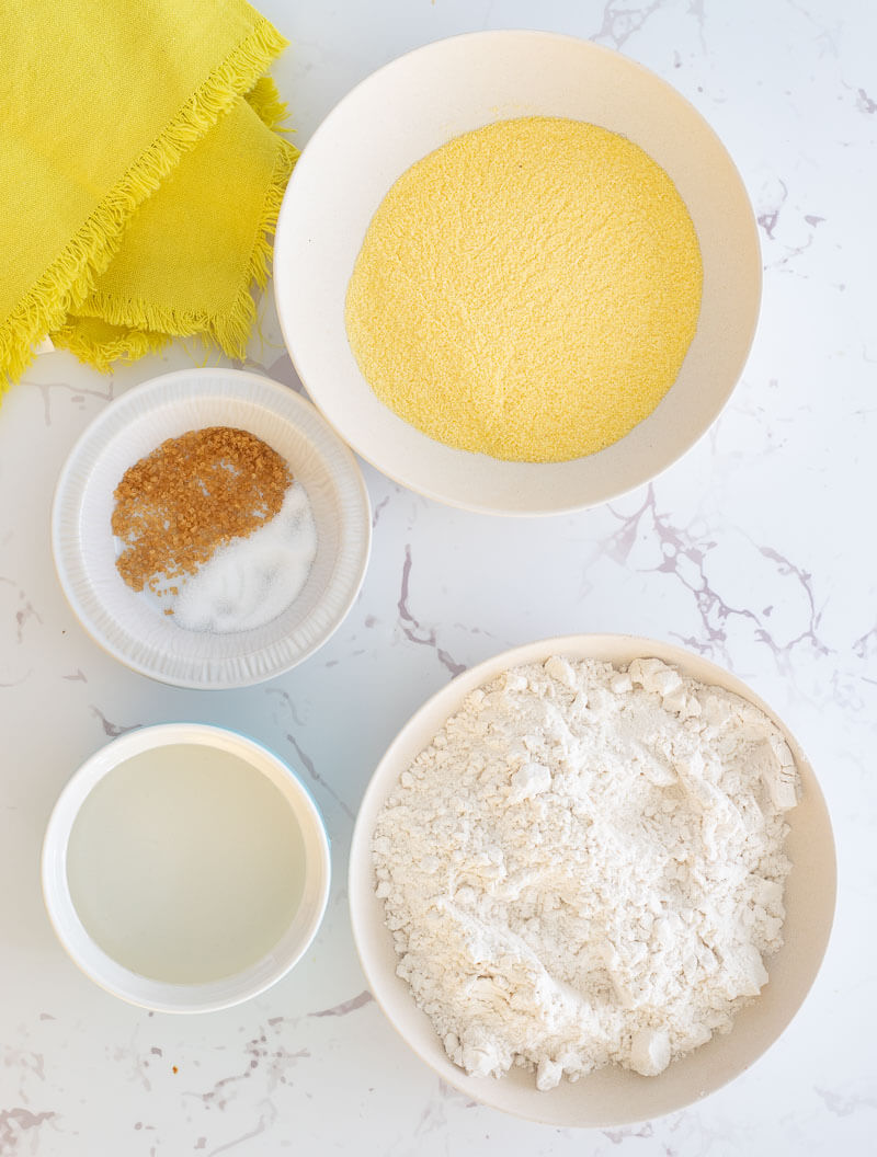 Ingredients needed to make the cornmeal dumpling shared out in portions for making.