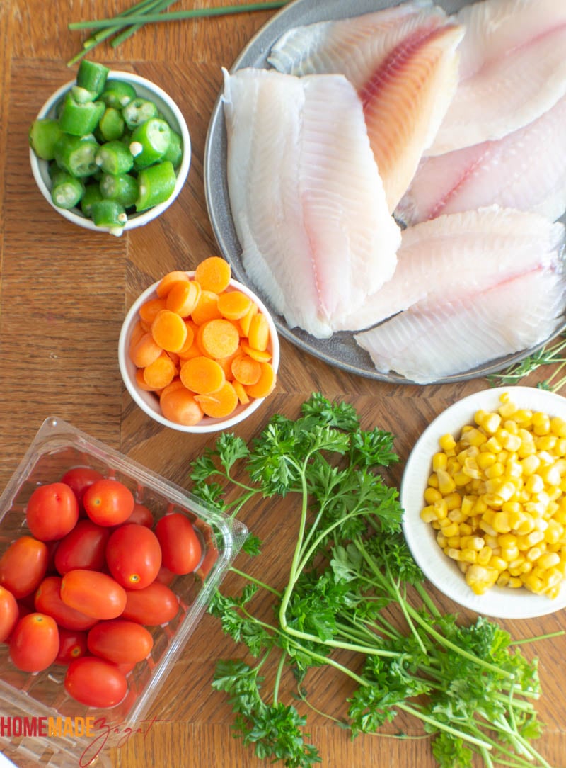Ingredients for fish packet: fish, okra, corn, carrots, chive