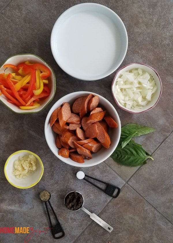 Sausage, bell peppers, coconut milk, onion and garlic. All ingredients for making this coconut milk pasta.
