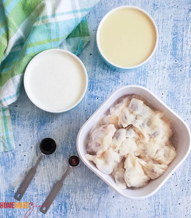 Soursop pulp, condensed milk, heavy cream and essence. The ingredients for making soursop ice cream