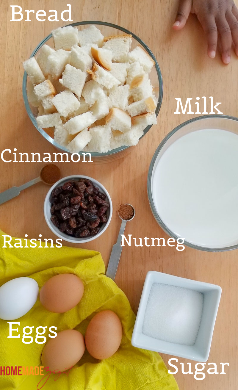 Ingredients for Jamaican bread pudding - raisins, bread, eggs, sugar, spices
