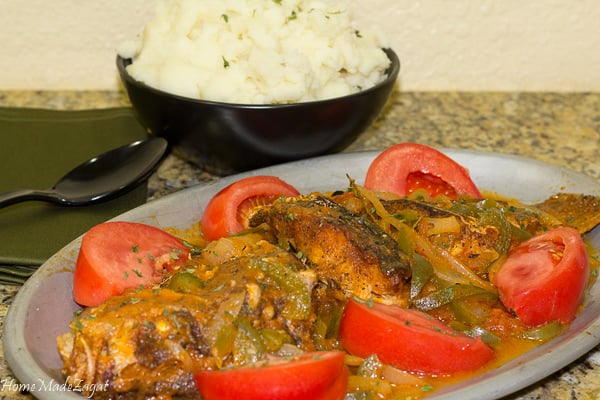 Brown Stew Fish - A quintessential Jamaican dish of fried fish then simmered in a sweet and tangy sauce. #HomeMadeZagat